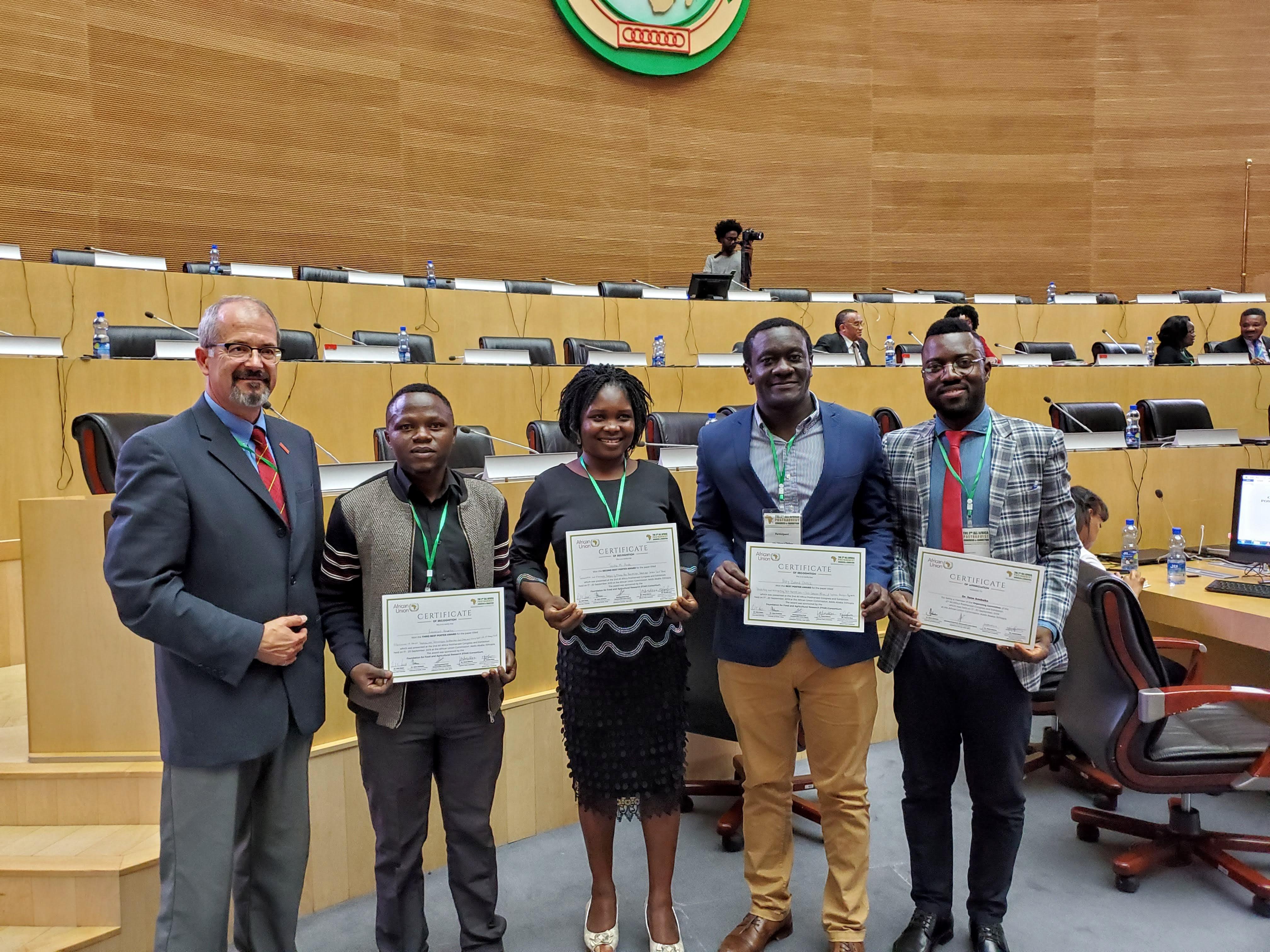 Winners of the Consortium sponsored student poster session at the 2nd All-Africa Post-Harvest Congress with Dr. Dirk Maier (left) and Dr. Olaniyi A. Fawole (Right) 