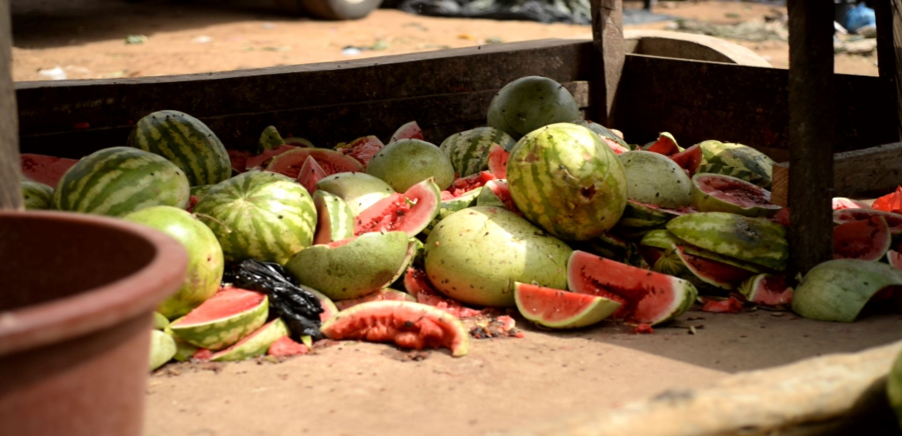 Watermelons left to rot at Afia Kobi vegetable market in Kumasi, Ghana